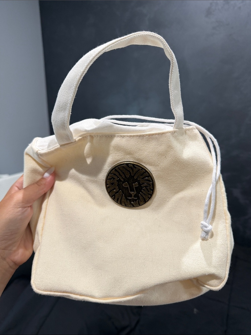 Anne Klein Cream Canvas Tote Bag with Lion Medallion